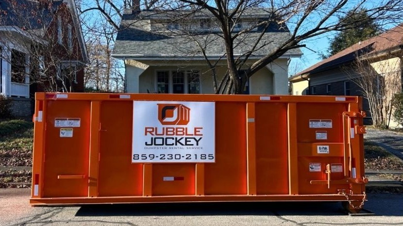 Rubble Jockey 20-yard dumpster placed on a Lexington KY street in the Aylesford neighborhood with permit handled and extreme duty driveway protection